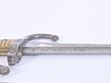 a sword that is laying on a table