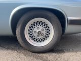 a close up of a car ' s tire on the road