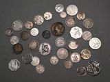 a lot of coins that are on the table