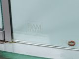 a close up of a glass door with a donut on it