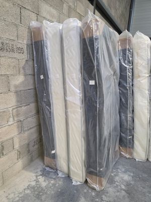 many mattresses wrapped up and ready to be shipped