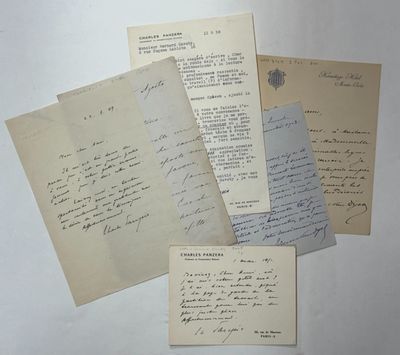 several old letters are sitting on top of a white table