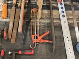 many tools that are on a workbench in a workshop