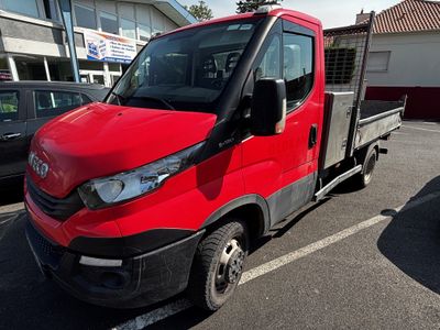 a red truck that is parked in a parking lot