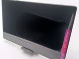 a black television sitting on top of a white table