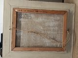 a picture of an old picture hanging on a wall