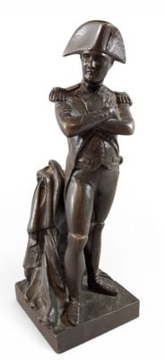 bronze statue of a man with a hat and a dog