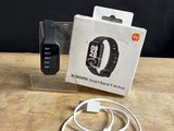 an apple watch and a charger sitting on a table