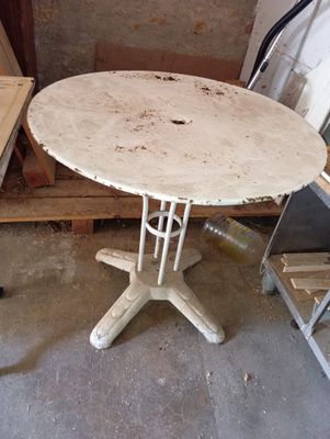 a white table with a wooden top in a room