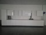 a picture of a kitchen with white cabinets and a microwave