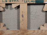 a picture of a wooden frame with a sign on it