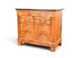 a small chest of drawers with a marble top
