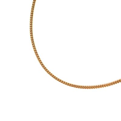 gros plan d'un collier en or sur fond blanc