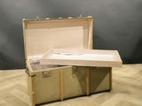 an open suitcase sitting on the floor on a wooden floor
