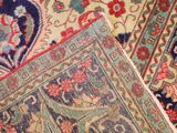 a close up of a carpet with many different colors