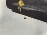 a black suitcase with a yellow object in it