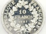 a close up of a coin on a white surface