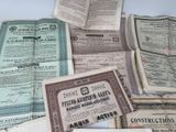 several old certificates are stacked on top of each other