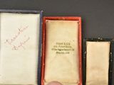 a person holding a small box with a picture on it