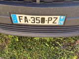 a close up of a car ' s grille with the number plate of a fiat