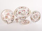 a group of plates and bowls with flowers on them