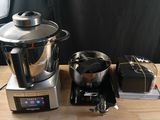 a blender sitting on top of a wooden table next to a blender