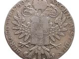 une vieille pièce d'argent sur laquelle figure un blason