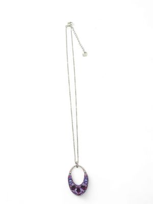 a purple necklace with a circular pendant on a chain