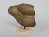 an image of a bronze sculpture of a head on a marble base