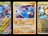 three pokemon cards are shown in a row on a black background