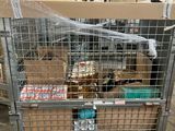 a large metal cart with boxes on it in a warehouse