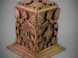 an old wooden box with a carved design on it