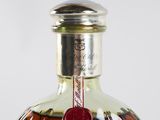 a close up of a bottle of liquor on a table