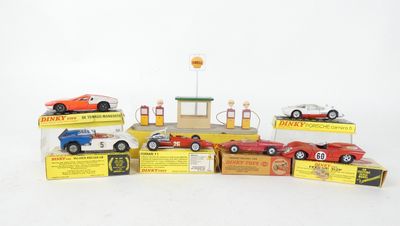 several toy cars are lined up on top of each other