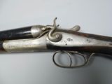 an old gun that is on display on a table