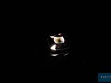 a candle that is lit up in the dark