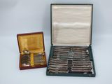 a box of silver spoons and a box of silver spoons