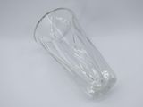 clear glass tumbler with a clear base on a white surface