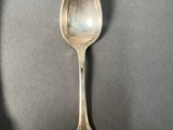 a spoon and a spoon rest on a table