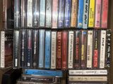 a lot of dvds in a box on a shelf