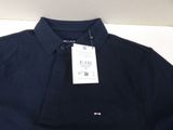 a close up of a polo shirt with a tag on it