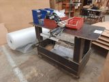 a workbench with tools on top of it in a warehouse