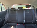the back seats of a car are black and grey in color
