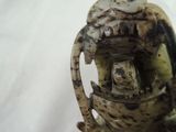 a close up of a figurine of a man with a hat on