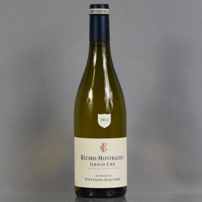 a bottle of white wine sitting on a table