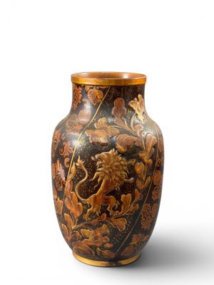an image of a vase with a lion on it