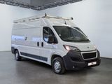 a picture of a white van parked inside of a building