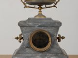 a clock that is sitting on top of a table