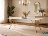 une table blanche aux pieds dorés et un miroir accroché au mur