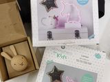 two boxes of toys on a table with a box on top of it